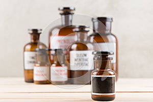 Retro pharmacy - vintage pharmacy bottles on wooden board