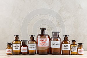 Retro pharmacy - vintage pharmacy bottles on wooden board photo