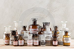 Retro pharmacy - vintage pharmacy bottles on wooden board photo