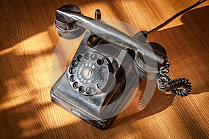Retro phone Soviet times on the table in the interior.