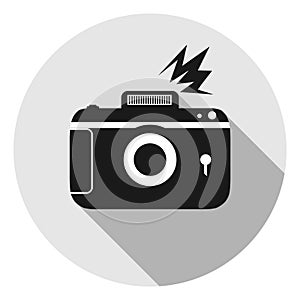 Retro photo camera. Retro photo camera icon with photo flash on gray background. Vector illustration.