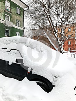 Retro Photo Of Snow Covered Car In Heavy Winter