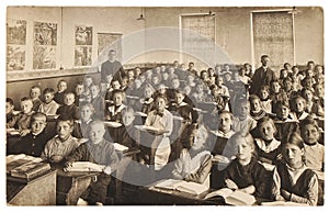 Retro picture of classmates. Group of children in the classroom