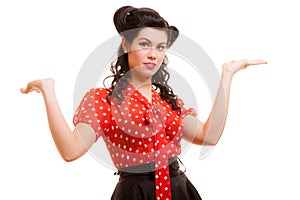 Retro pin-up girl young woman shrugging her sholders isolated