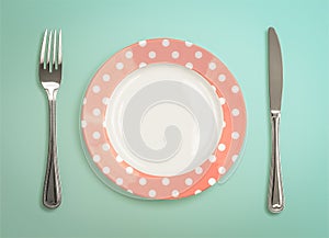 Retro plate with fork and knife top view
