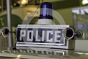 Retro police car sign and vintage siren 1980s UK