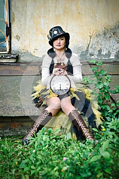 retro portrait of a beautiful woman with a clock in her hands. steampunk style.