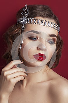 Retro portrait of a beautiful woman on a red Background.. Vintage style. Fashion Beauty photo. woman with curly hair