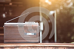 Retro radio cassette stereo on wooden table