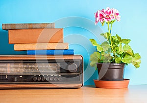 Retro radio with flower and books, vintage still life