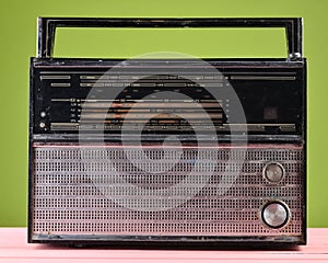 Retro radio on a green pastel background.