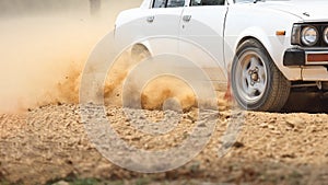 Retro Rally Car turning in dirt track