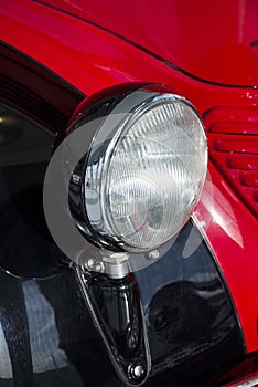 Retro red car Mercedes headlight close up