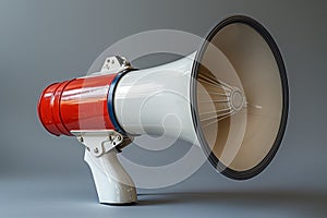 Retro red and white megaphone on a grey background