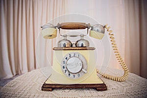 Retro rotary telephone on wood table