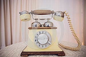 Retro rotary telephone on wood table