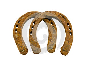 Retro rusty pair of horseshoes isolated on white