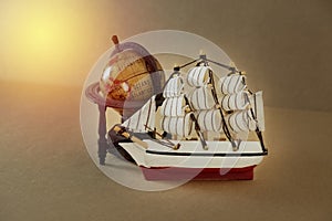 Retro sailing boat and globe model