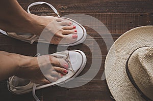 Retro sneakers left on wooden floor