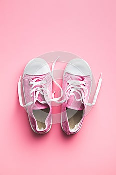 Retro sneakers. Tennis shoes on pink background