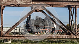 Retro Soviet steam locomotive. Veteran railways. Vintage black steam locomotive train rush railway