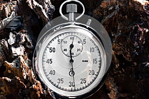 Retro stopwatch on a wooden background. Time tracking