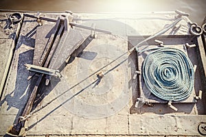 Retro style anchor with rope on a military floating bridge