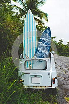 Retro style car with surf boards