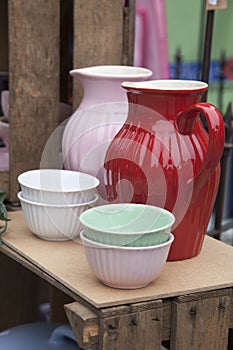 Retro style ceramic pitchers or jugs and bowls in different colors