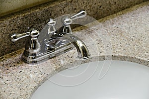 Retro style Chrome Faucet and old sink in bathroom