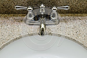 Retro style Chrome Faucet and old sink in bathroom