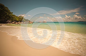 Retro style image of tropical island beach