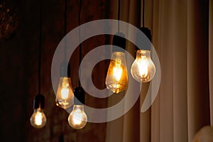 retro style lamps hang near the old brick wall in temon, retro illumination, interior decor, retro light