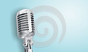 Retro style microphone on blue background
