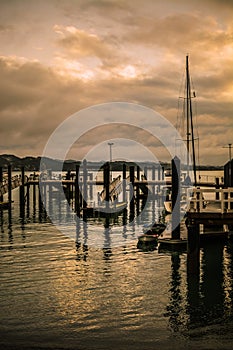 Retro style photo of Russel Wharf on a stormy day. Low tide