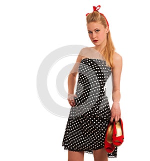 Retro style pin up girl with blonde hair in black dress wtih whi