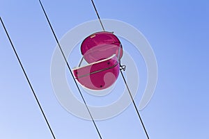 Retro Style Pink Cage Suspension Ride With Blue Sky Background, at Santa Cruz Beach Boardwalk