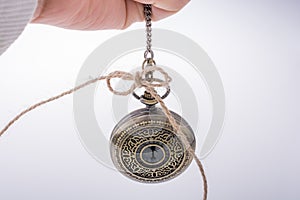 Retro style pocket watch in hand