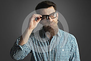 Retro style portrait of a man with mustache and beard wearing glasses