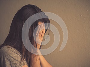 Retro style of sad woman sitting alone in a empty room.