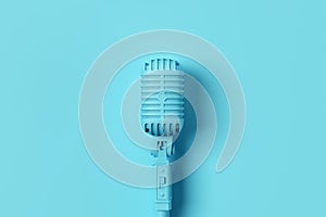 Retro style vintage blue microphone on blue background