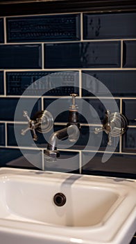 Retro-styled copper faucet collection, which features wall mounted home garden faucets, with an aged brass finish and