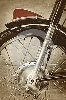 Retro styled image of the front of an old motorcycle