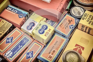 Retro styled image of old color slide film packs on a flee marke