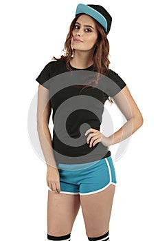 Retro styled sports model wearing a blank black t-shirt and blue running shorts teamed up with a baseball cap