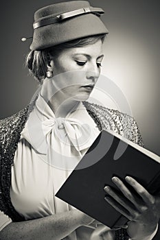 Retro Styled Woman Reading A Book