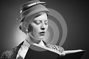 Retro Styled Woman Reading A Book