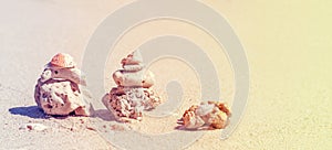 Retro stylized coral pyramids on beach.