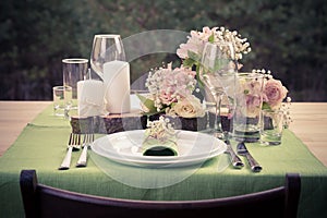 Retro stylized photo of table setting in rustic style.