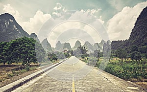 Retro stylized picture of a countryside road, China.